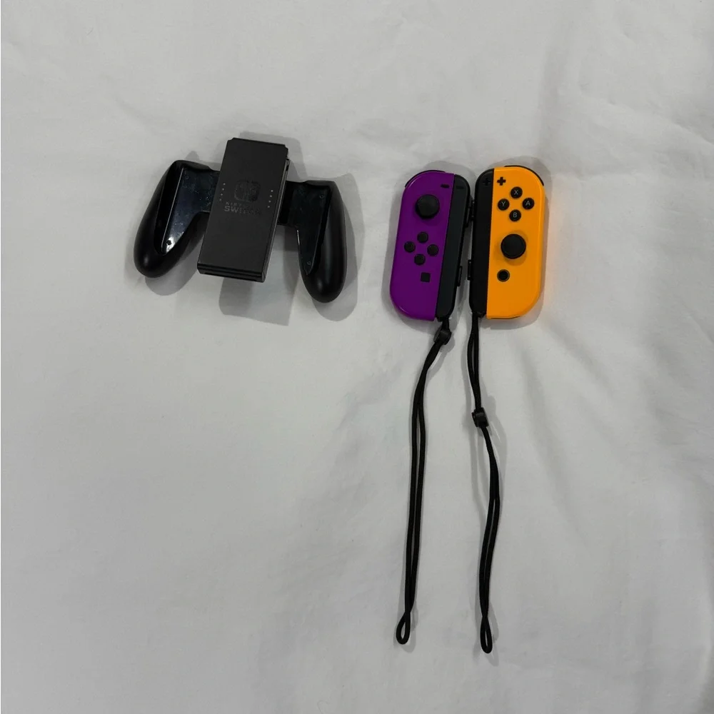 Nintendo Switch with Gray, Purple, and Orange Joy-Con Controllers